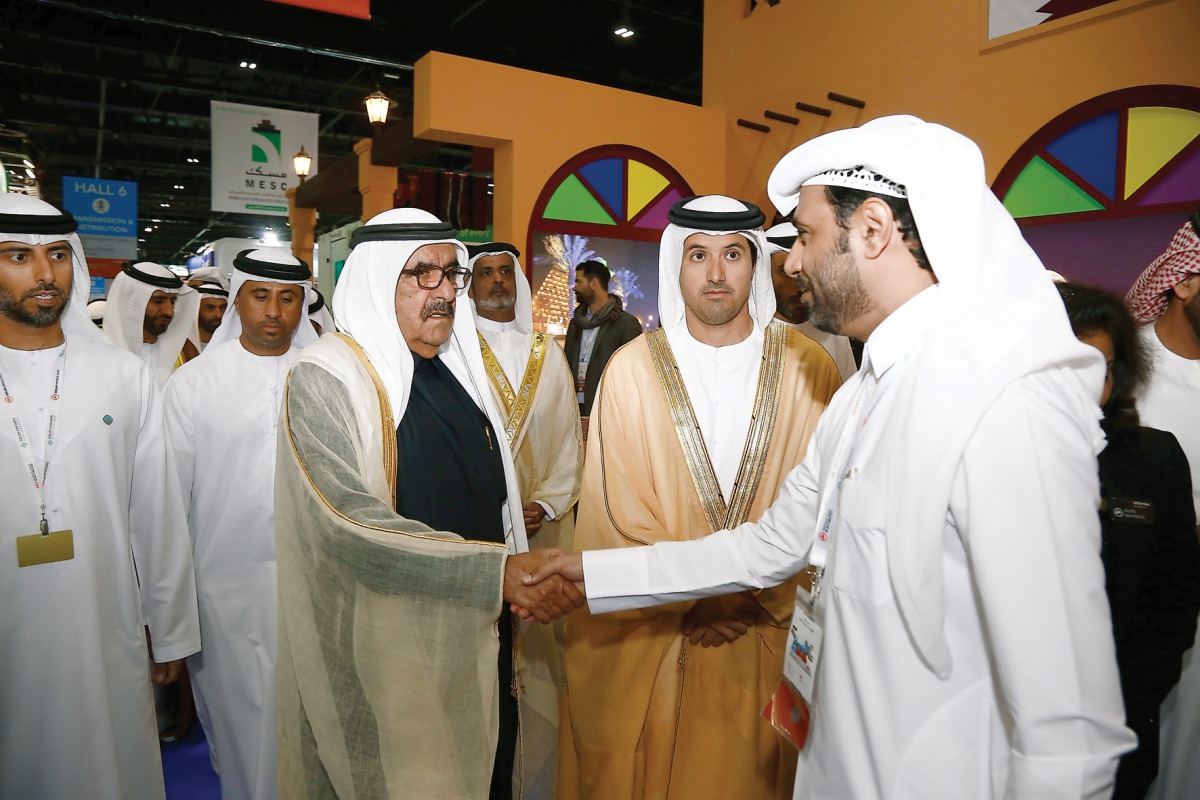 A Qatari official receiving a VIP visitor at the Qatar pavilion in Dubai World Trade Centre.