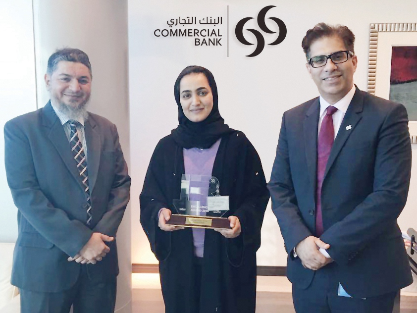 Commercial Bank officials with the award.