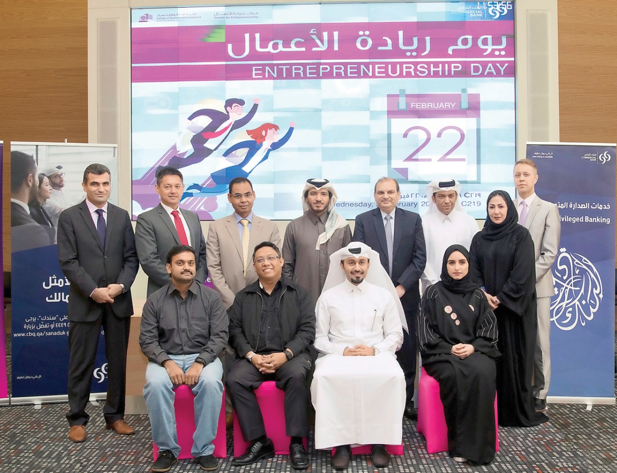 Commercial Bank officials, exclusive sponsor of  Qatar University's 'Entrepreneurship Day', pose for a group photo.