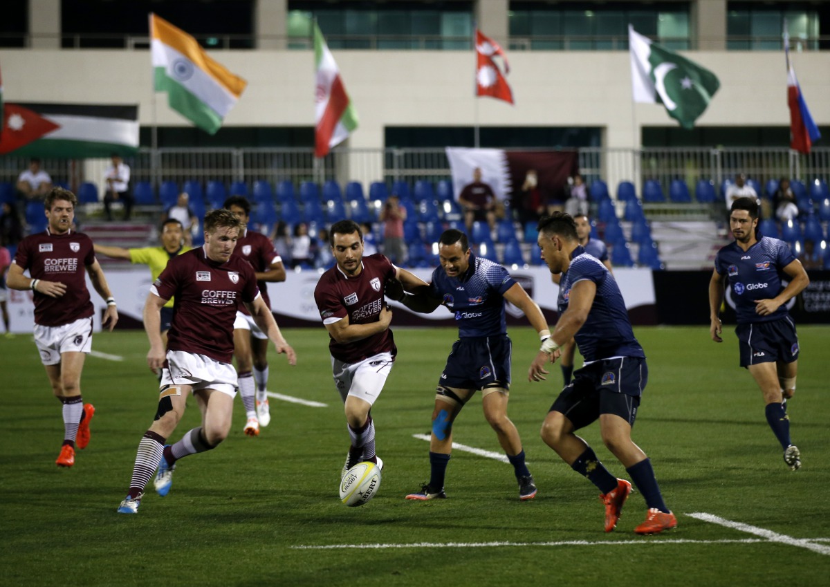 Qatar and Philippines players in an earlier match.