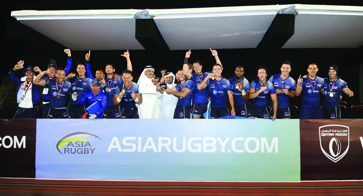 Qatar Rugby Federation President Yousef Al Kuwari giving away the Asia Rugby Sevens Trophy 2017 (ARST) to Philippine team at the Aspire Warm-up Track and Rugby Stadium yesterday. Phillipines defeated Thailand 41-7 in the two-day tournament.