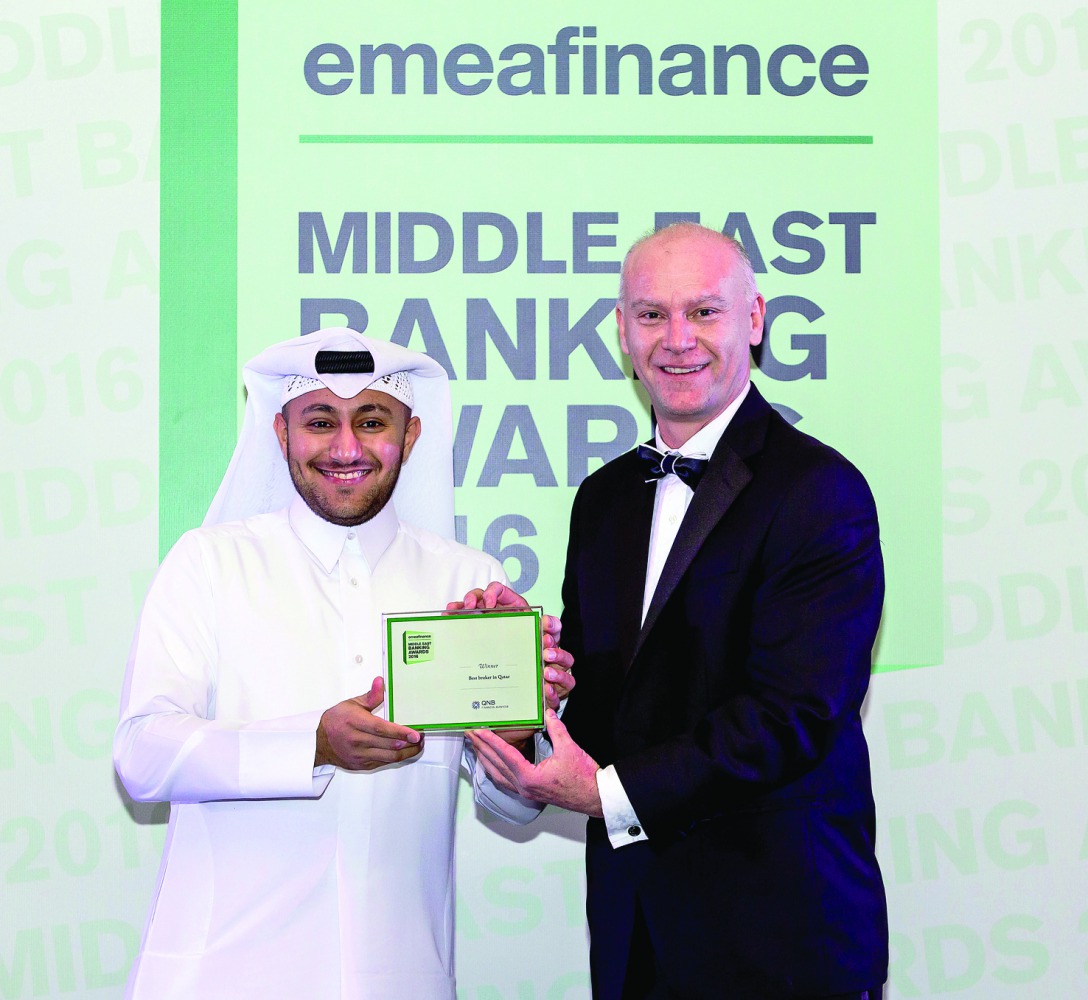 A QNBFS official receiving the award.