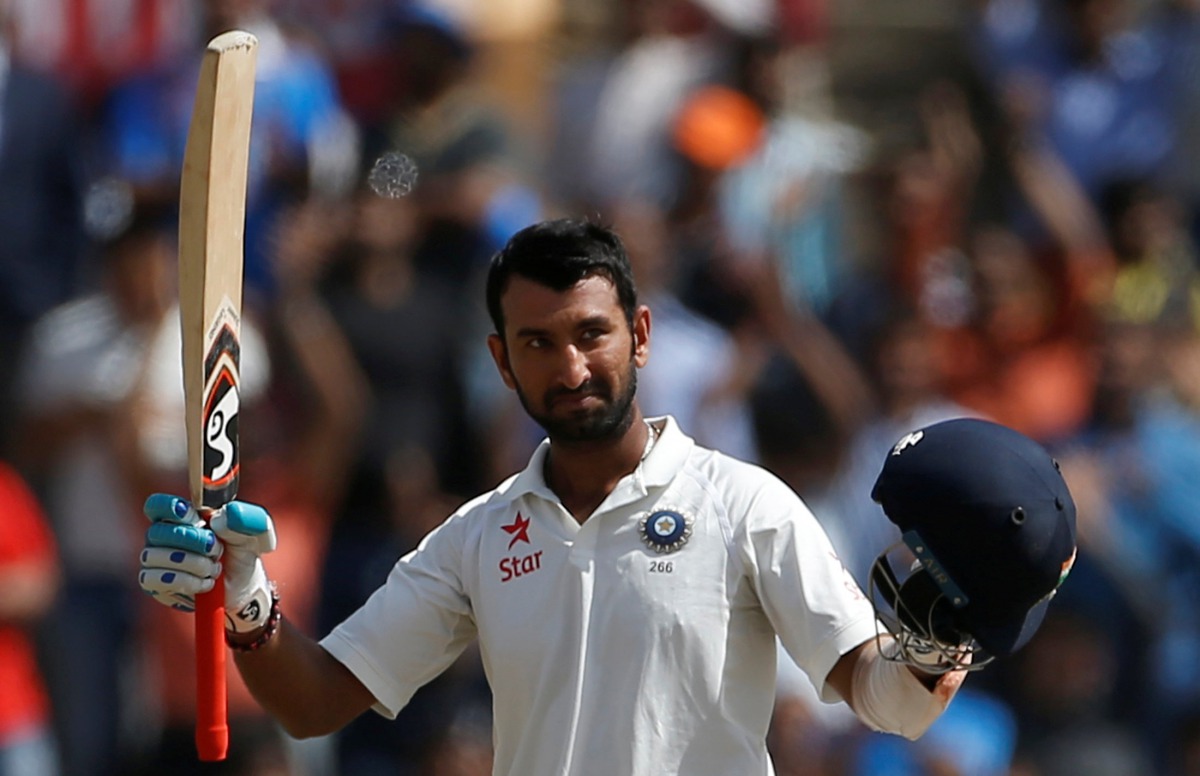 India's Cheteshwar Pujara celebrates his century. (REUTERS/Adnan Abidi)
