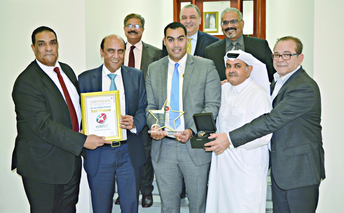 Officials of Mannai Automotive Group with the award.