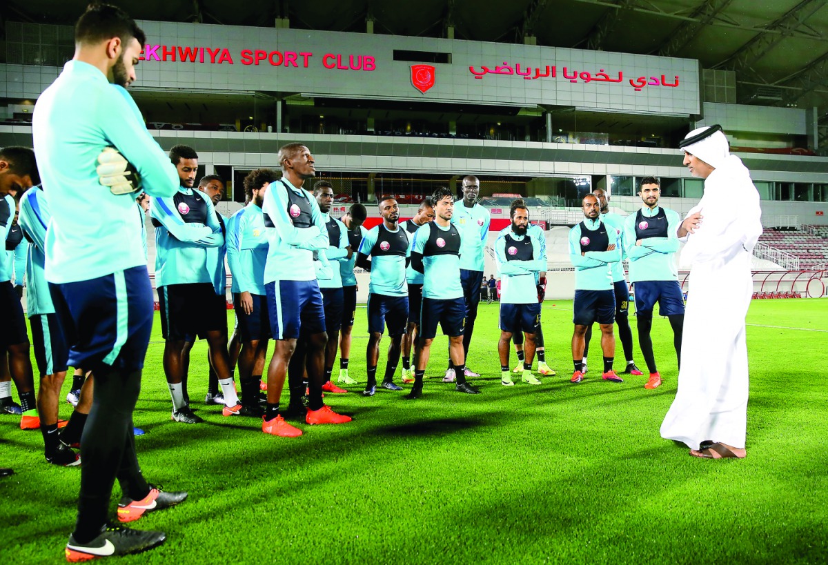 Qatar Football Association (QFA) President Sheikh Hamad bin Khalifa bin Ahmed Al Thani talks to the national team players during a training session at Lekhwiya Stadium on Saturday.
