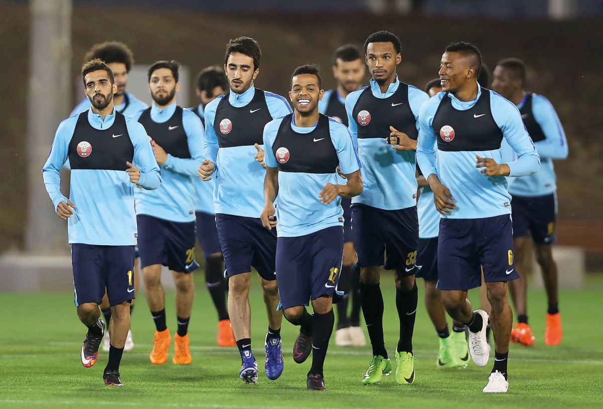 Qatar national team players taking part in a training session under the watchful eyes of coach Jorge Fossati in Doha yesterday.