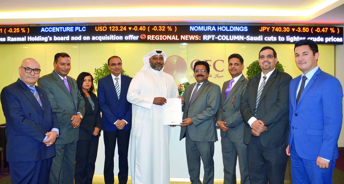  QFC and IBPN Officials pose for a group photo with the official registration documents.