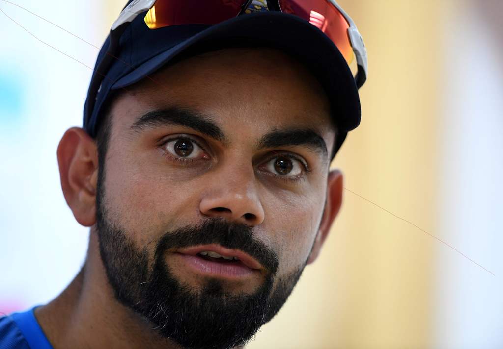 (FILES) In this photograph taken on March 24, 2017, India's captain Virat Kohli addresses a press conference on the eve of fourth and final cricket Test match between India and Australia at The Himachal Pradesh Cricket Association Stadium in Dharamsala. G