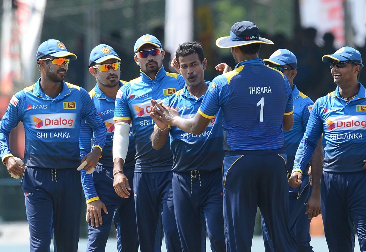 Sri Lankan cricketer Nuwan Kulasekara (C) celebrates with teammates after he dismissed Bangladesh batsman Tamim Iqbal during the third and final one day international (ODI) cricket match between Sri Lanka and Bangladesh at The Sinhalese Sports Club (SSC) 
