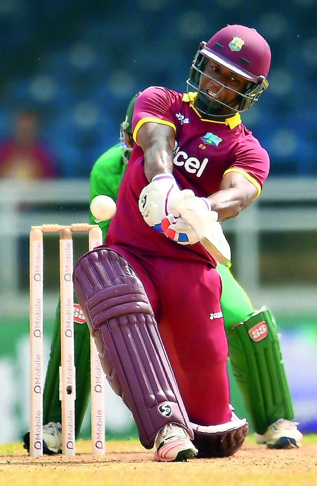 West Indies' Evin Lewis hits a boundary during the third T20I against Pakistan at the Queen's Park Oval in Port of Spain, Trinidad, on Saturday. 