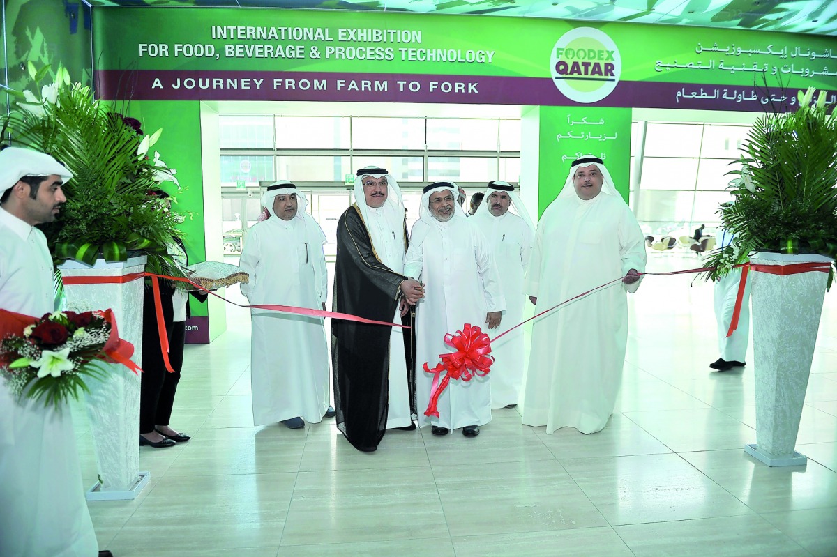 GOIC Secretary General Abdulaziz bin Hamad Al Ageel (second left), and Abdullah Al Naama, Director of Gulf Marketing Company, cutting the ribbon for the official opening of the GOIC First Forum for Food Security and Manufacturers of Food in the GCC which 