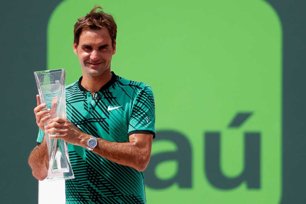 Roger Federer of Switzerland holds the Butch Buchholz trophy after his match against Rafael Nadal of Spain (not pictured) in the men's singles championship of the 2017 Miami Open at Crandon Park Tennis Center. Federer won 6-3, 6-4. Geoff Burke
