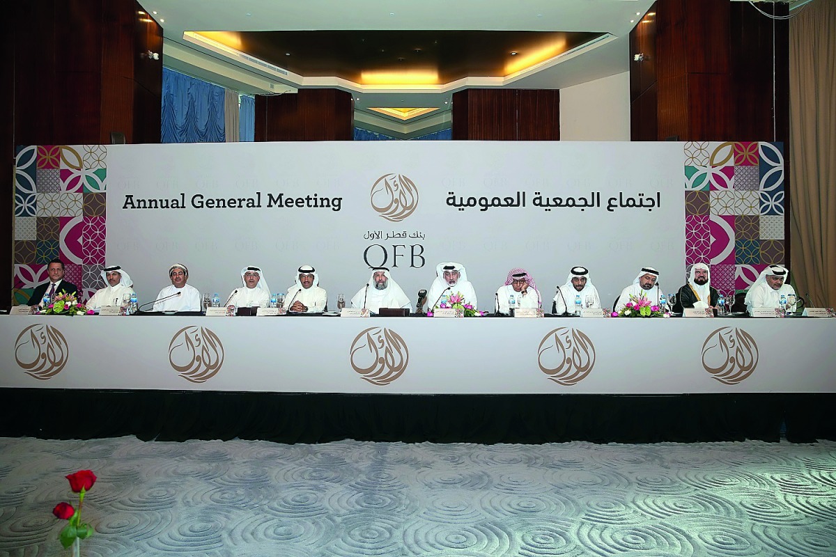 Abdulla bin Fahad bin Ghorab Al Marri (third right), Chairman of the Board of Directors of QFB and other board members at the AGM in Doha yesterday.