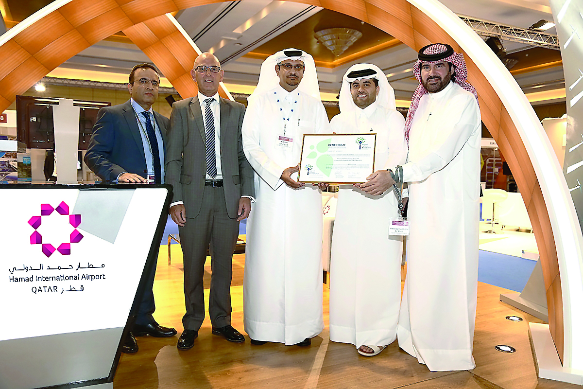 Eng. Badr Mohammed Al Meer, Chief Operating Officer of HIA and Special Adviser to the ACI Asia-Pacific Board, and other officials with the certificate during the 12th ACI Asia-Pacific Regional Assembly in Doha.