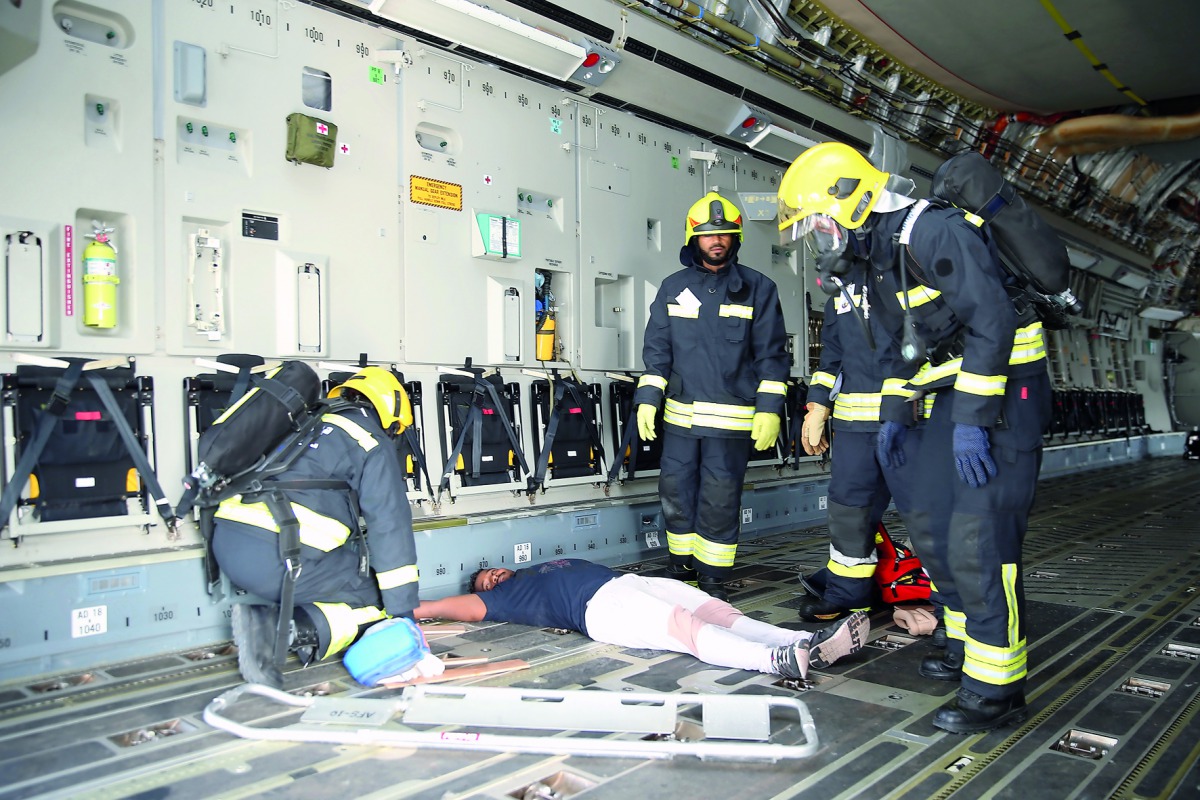 Rescue workers attending to a patient during the drill. Emiri Air Force and medical personnel who participated in the military exercise.