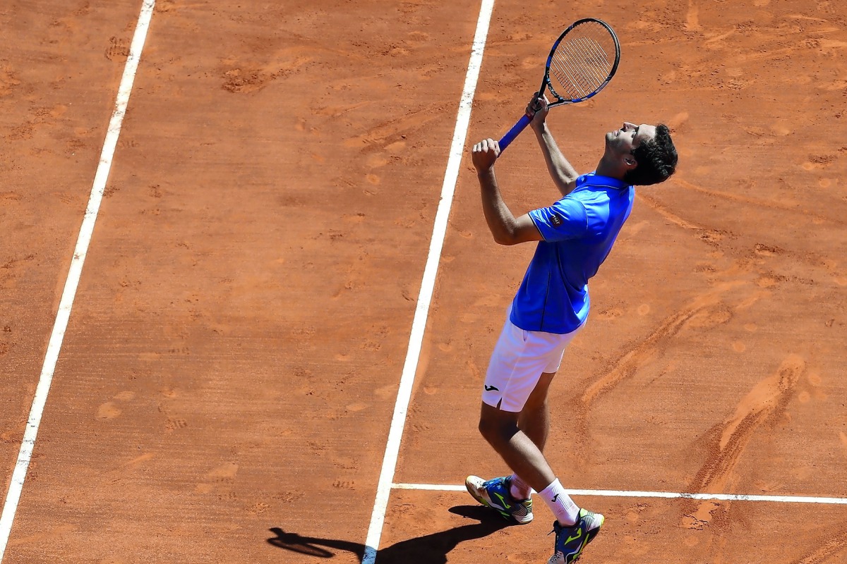 Spain's Albert Ramos Vinolas celebrates his victory over Britain's World number one Andy Murray during the Monte-Carlo ATP Masters Series tennis tournament yesterday.