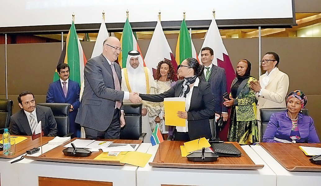 Foreign Minister H E Sheikh Mohammed bin Abdulrahman Al Thani (left, sitting); Minister of Economy and Commerce, H E Sheikh Ahmed bin Jassim Al Thani, Ashraf Abu Issa, Chairman of Abu Issa Holding and other senior officials at the agreement signing ceremo