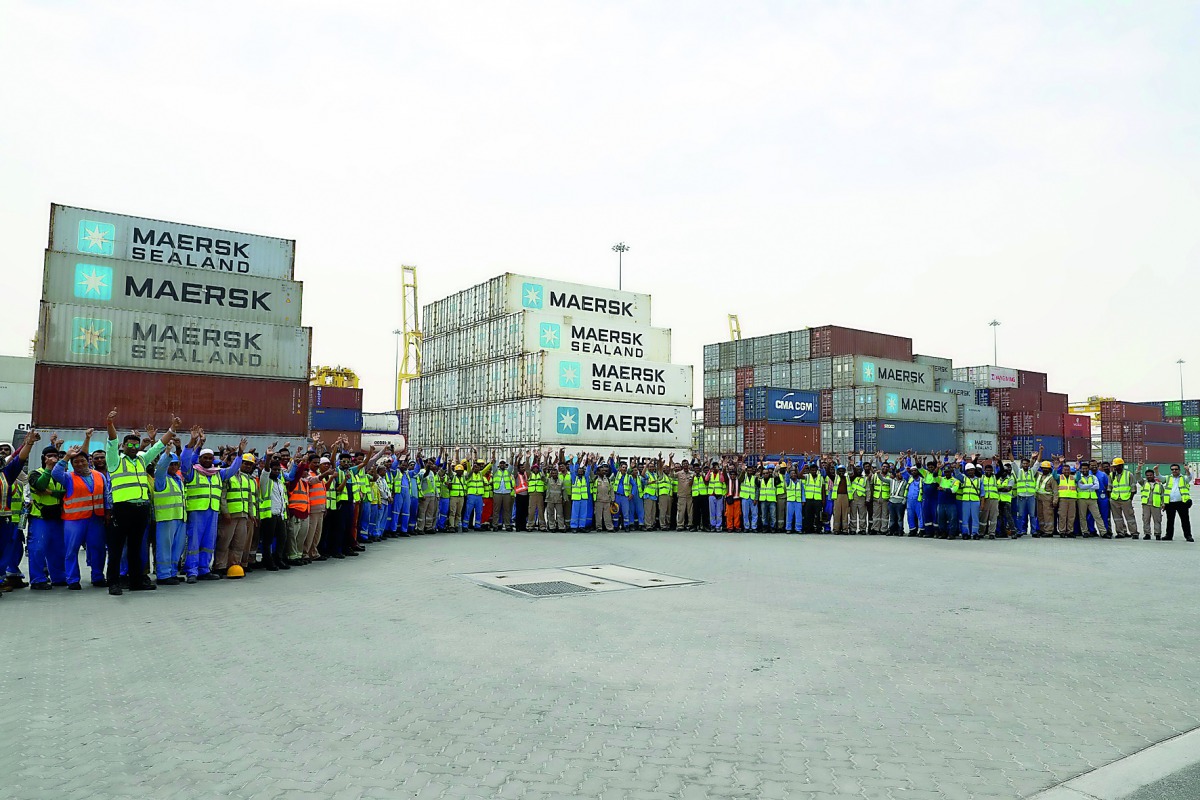 Jubilant workers of Qatar Ports Management Company — Mwani Qatar — marking the International Workers’ Day yesterday. Gifts and snacks were distributed among the workers who expressed their happiness on their day.