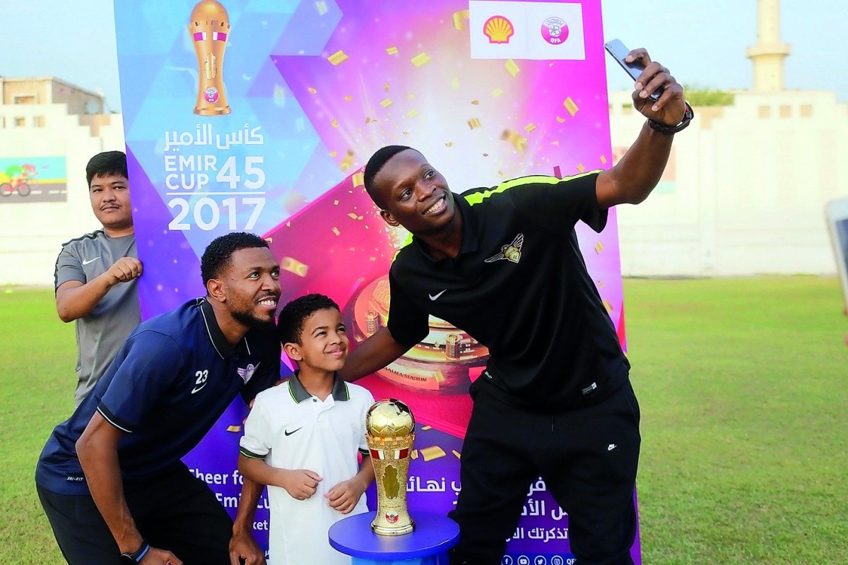 El Jaish players take a selfie with school students of Khalifa Secondary School for Boys during the Emir Cup trophy tour in Doha.