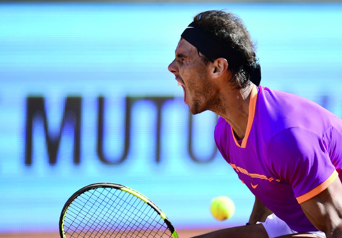 Spain's Rafael Nadal celebrates the last point against Serbian tennis player Novak Djokovic during their ATP Madrid Open semi-final match in Madrid on Saturday. 