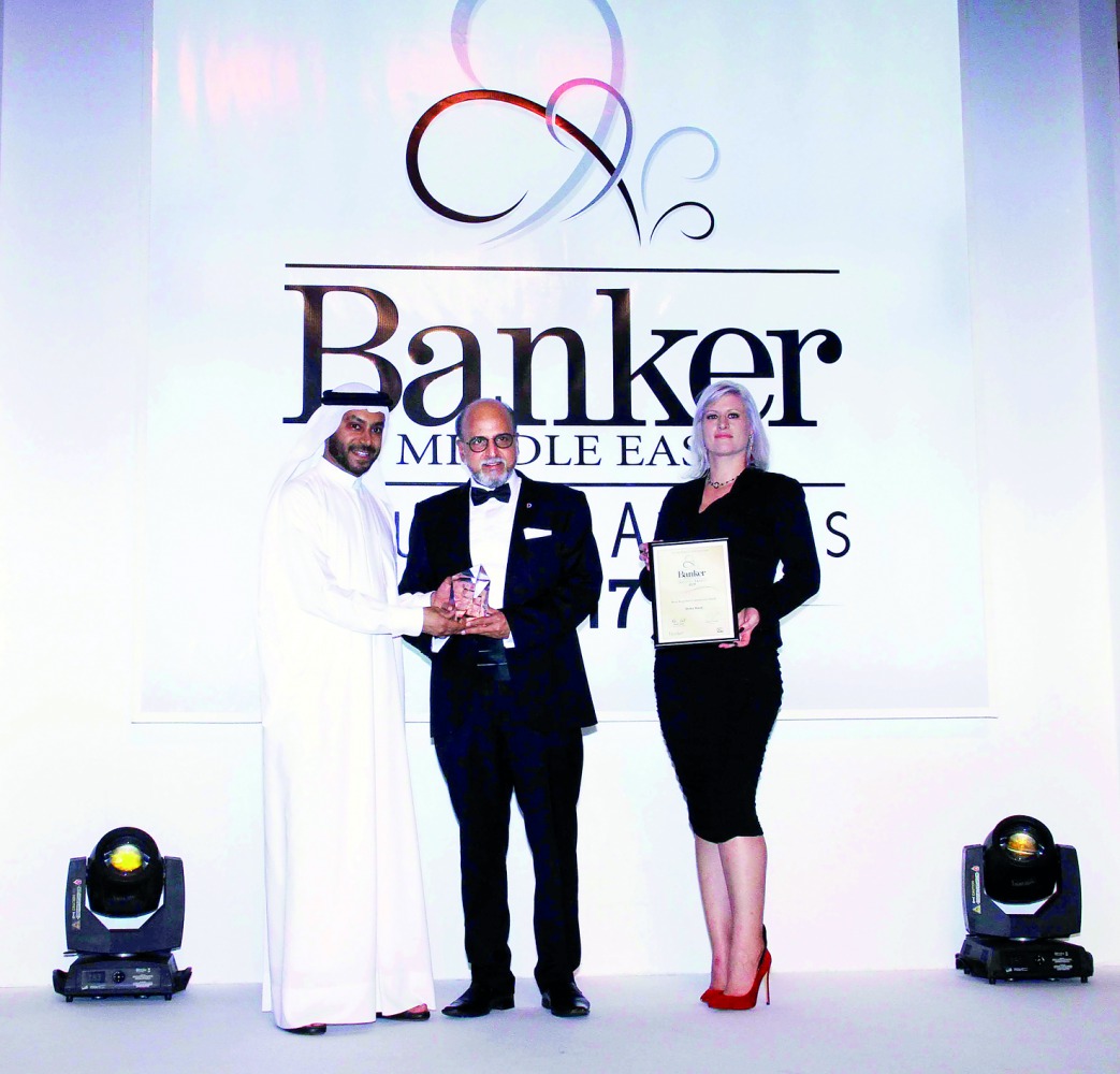 Dr R Seetharaman (centre), Group CEO of Doha Bank, receiving  the award at Emirates Tower Hotel, Dubai, recently.  