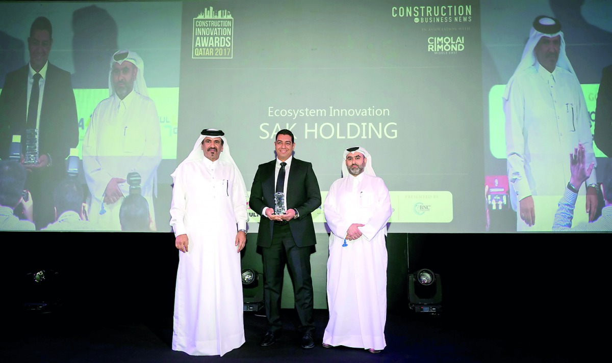 Ahmed El Sayed, General Manager, SAK Trading & Contracting Company, accepting the award on behalf of Sheikh Thani bin Abdullah Al Thani, Chairman of the Board of Directors of SAK Holding Group, from Mohamed bin Ahmed bin Towar Al Kuwari, Vice-Chairman of 