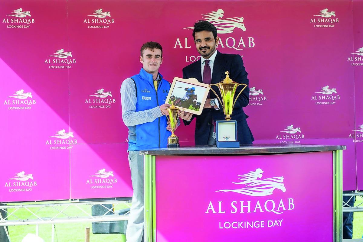 Sheikh Joaan bin Hamad Al Thani, President of Qatar Olympic Committee, presenting the trophies to the winners of the main race, Al Shaqab Locking Stakes (Gr1), of the race meeting held at Newbury on Saturday.