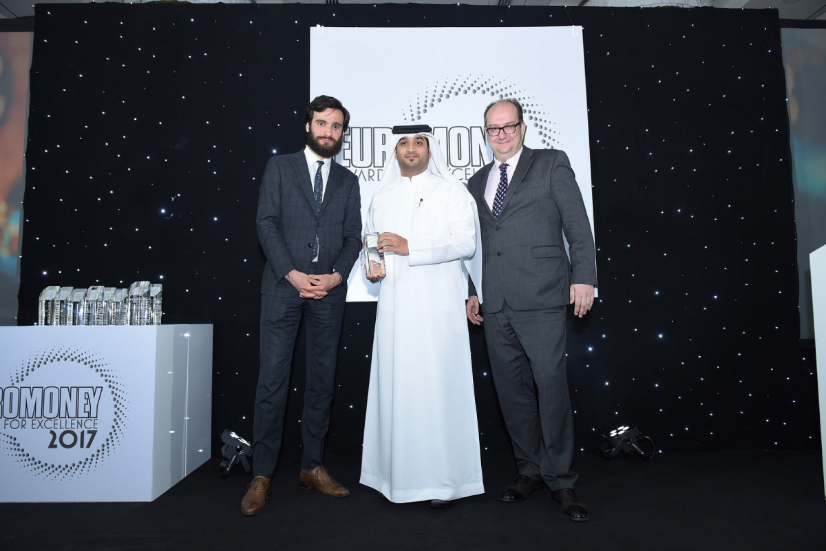 QNB official receiving the award.