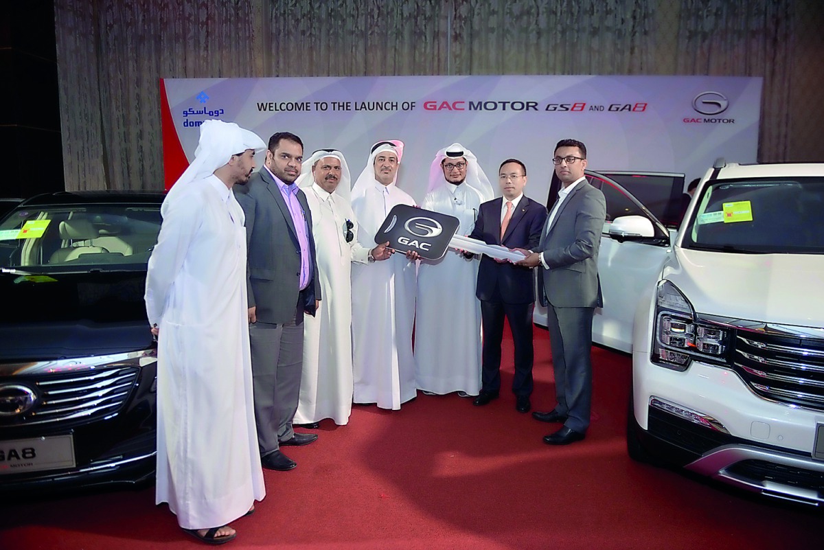 Faisal Sharif (right), Managing Director of DOMASCO, and Wang Shunsheng, Deputy General Manager of GAC Motor, presenting first car owners with keys during the launch of the all new GS8 and GA8 from GAC Motor at St Regis Hotel. Pic: Baher Amin/The Peninsul