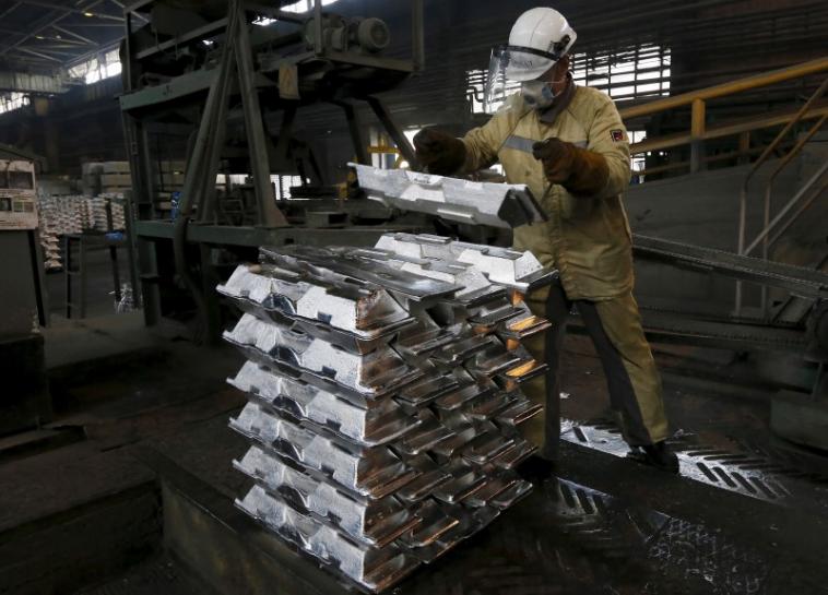 A worker stacks aluminium ingots at the foundry shop of the Rusal Sayanogorsk aluminium smelter outside the town of Sayanogorsk, Russia, September 3, 2015. REUTERS/Ilya Naymushin