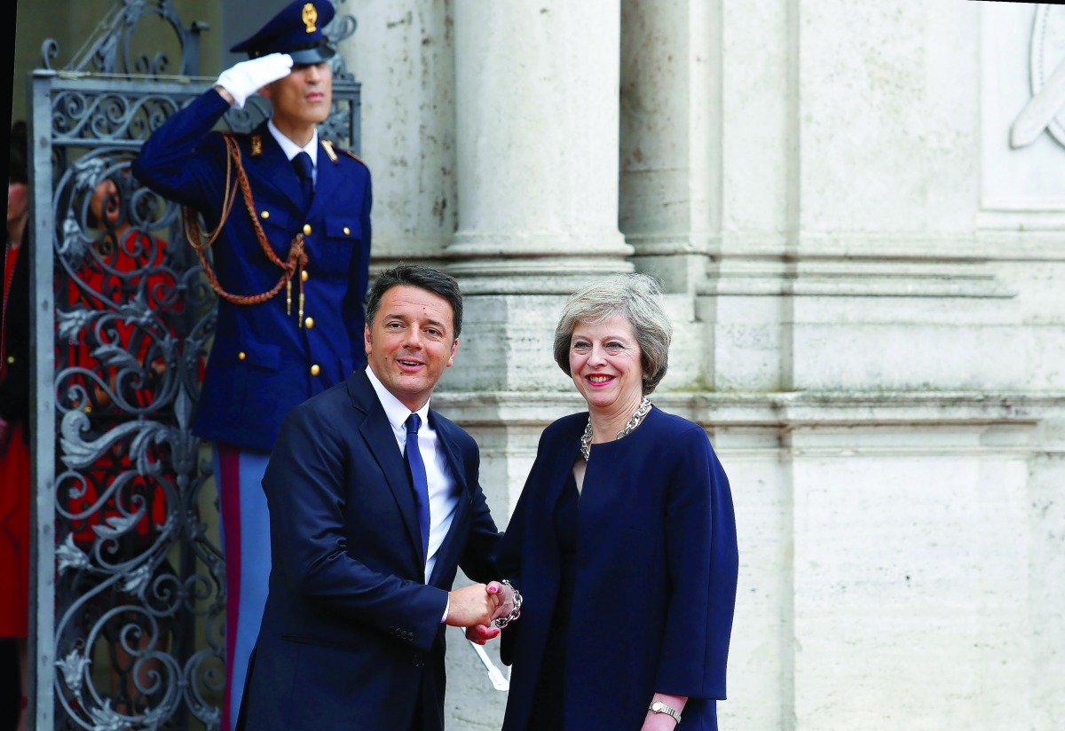 British Prime Minister Theresa May shakes hand with Matteo Renzi during a meeting in Rome, July 27, 2016 (REUTERS / Remo Casilli). Sterling, hammered by a slump for Prime Minister Theresa May's Conservatives in opinion polls last week, recovered after wee