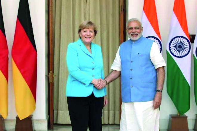 Chancellor Angela Merkel (left) shakes hand with India's Prime Minister Narendra Modi.