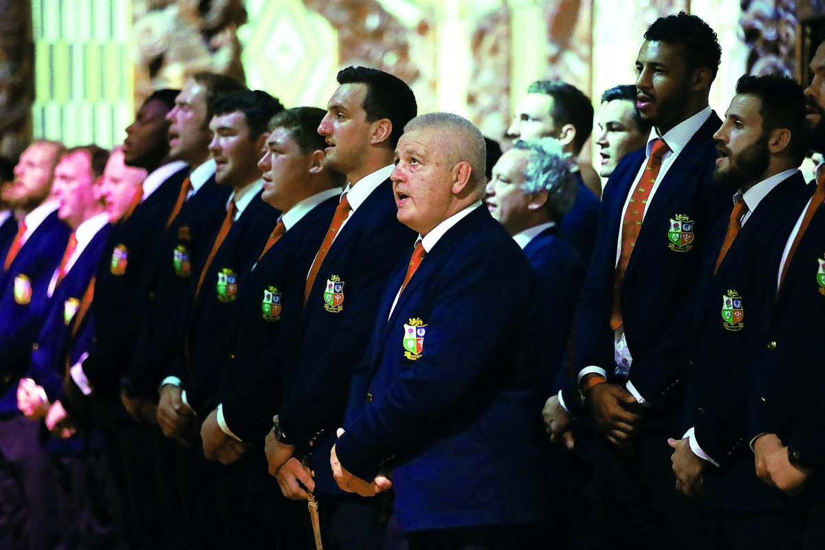 British and Lions rugby head coach Warren Gatland (centre) sings with the rest of the team in the meeting house during a Maori welcoming at Waitangi Treaty Grounds in Waitangi, yesterday.