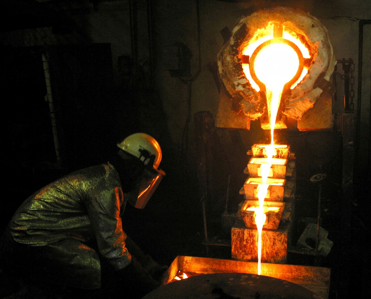 FILE PHOTO: A worker pours gold at the AngloGold Ashanti mine at Obuasi Ghana