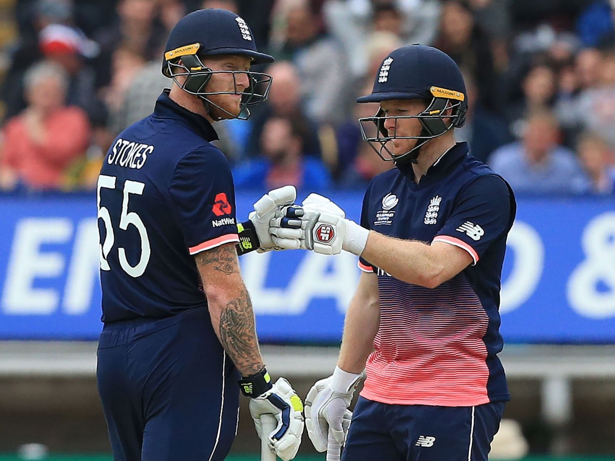 England's Eoin Morgan (R) and England's Ben Stokes (L) touch gloves during the ICC Champions Trophy match between England and Australia at Edgbaston in Birmingham, central England on June 10, 2017. Australia made 277 for 9 off their 50 overs.(AFP / Lindse