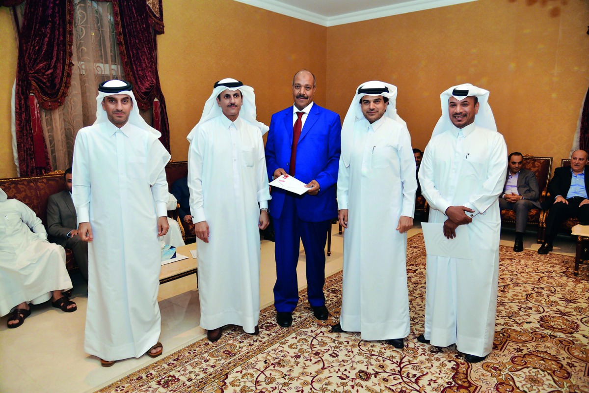 Sheikh Dr. Khalid bin Thani bin Abdullah Al Thani (second left), Chairman and Managing Director QIIB; Abdulbasit Ahmad Al-Shaibei (second right), CEO; Jamal Abdullah Al Jamal (left), Deputy CEO; and Ali Al Mesaifri (right), Chief, Human Resources and Gene