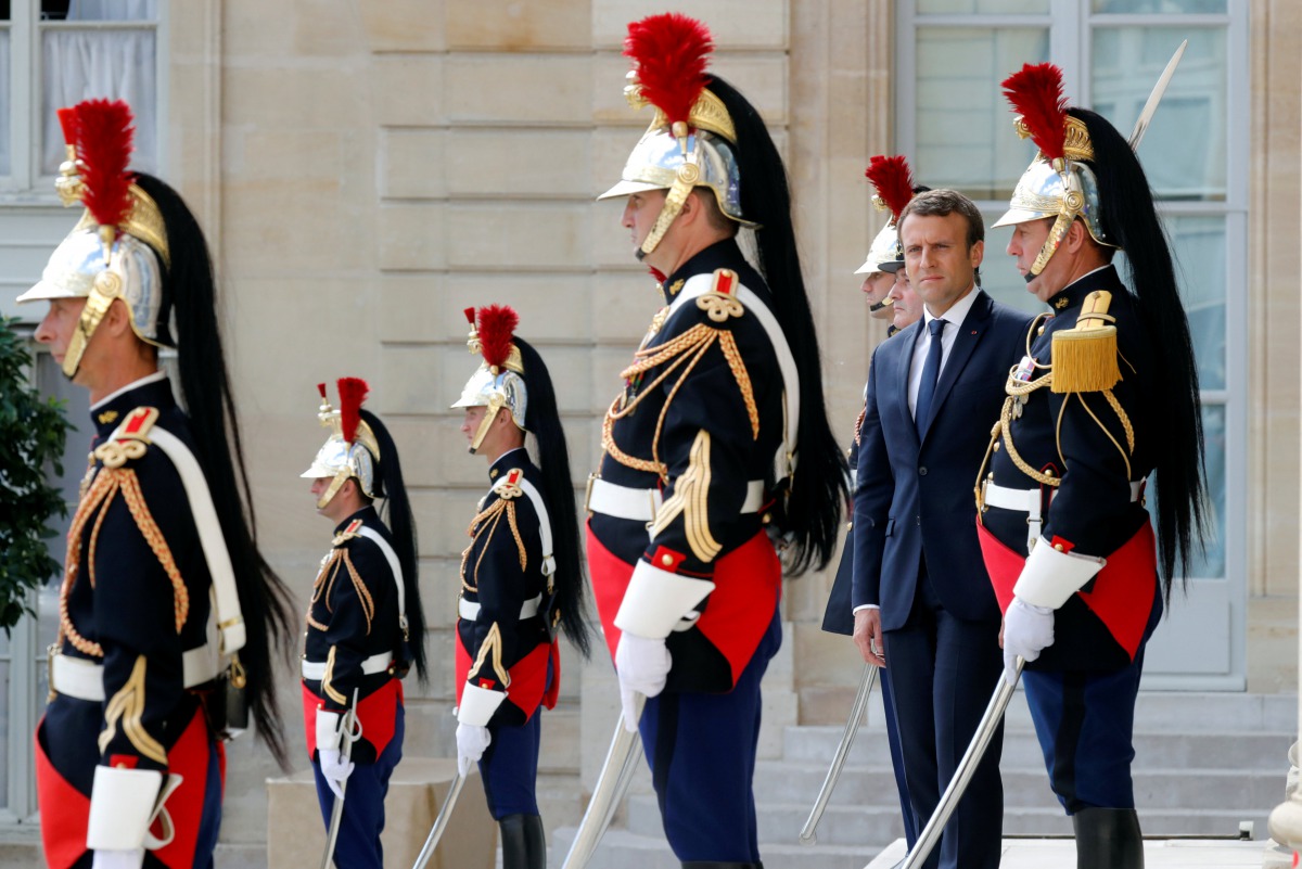 French President Emmanuel Macron waits for guests to leave at the Elysee Palace in Paris, France, June 12, 2017. REUTERS/Philippe Wojazer
