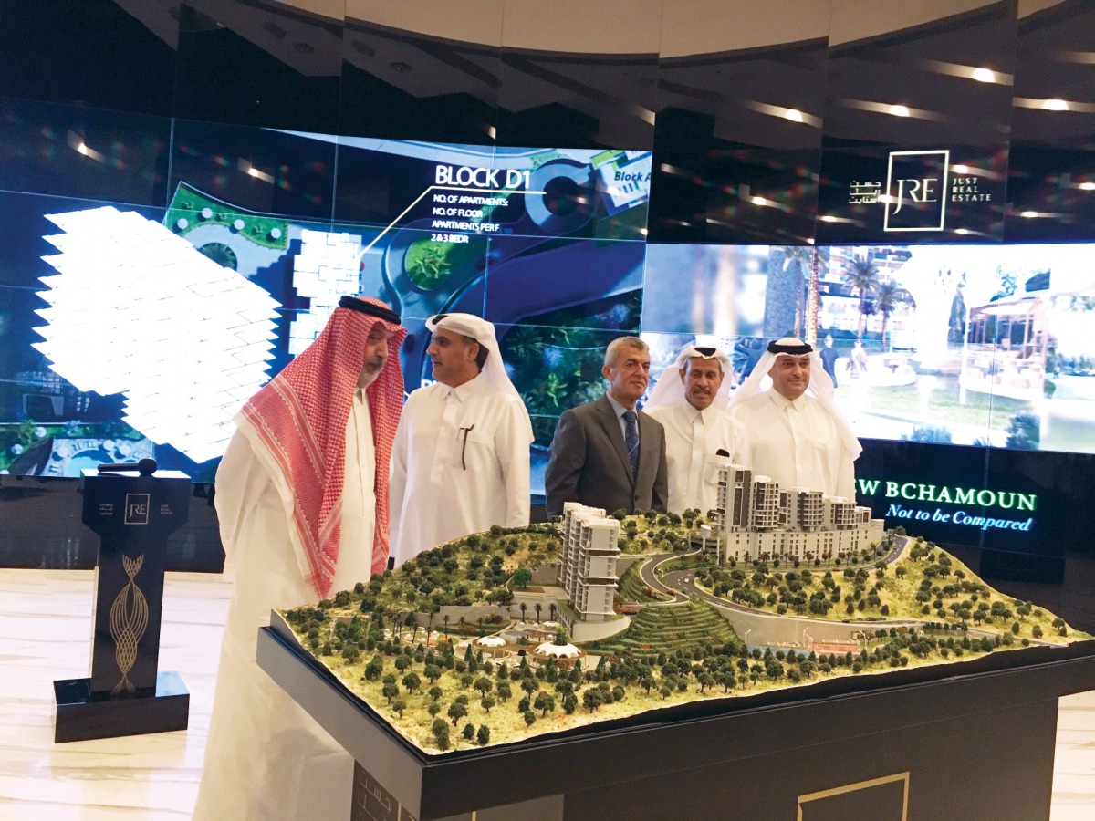 Just Real Estate officials  and  guests taking a look at the 'View Bchamoun' model  