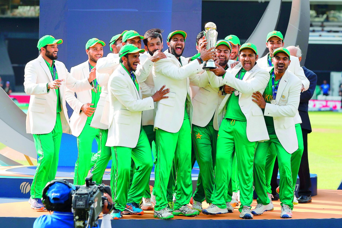 Captain Sarfraz Ahmed (third right) lifts the trophy as Pakistan team celebrate their win over India after the ICC Champions Trophy final at the Oval in London, on Sunday. 