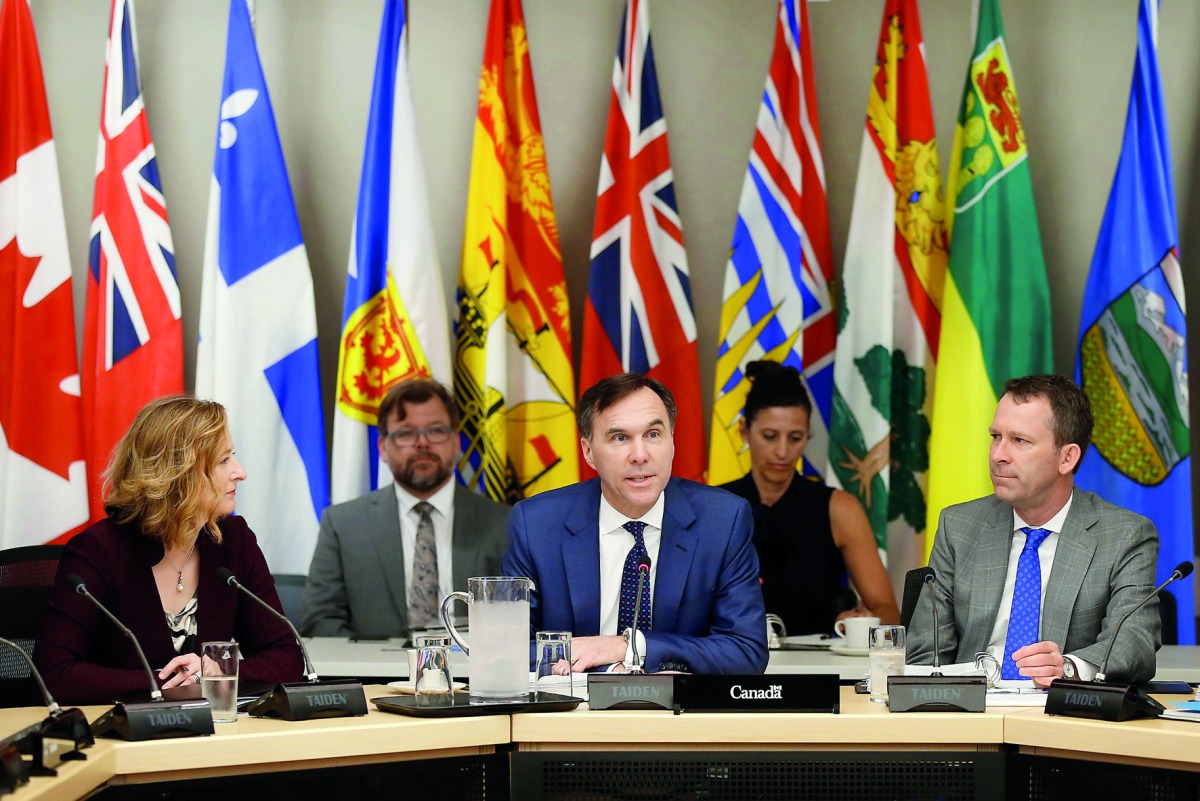 Canada's Finance Minister Bill Morneau (centre) speaks during a meeting, to discuss various economic issues, with his provincial counterparts in Ottawa, Ontario, Canada, yesterday. 