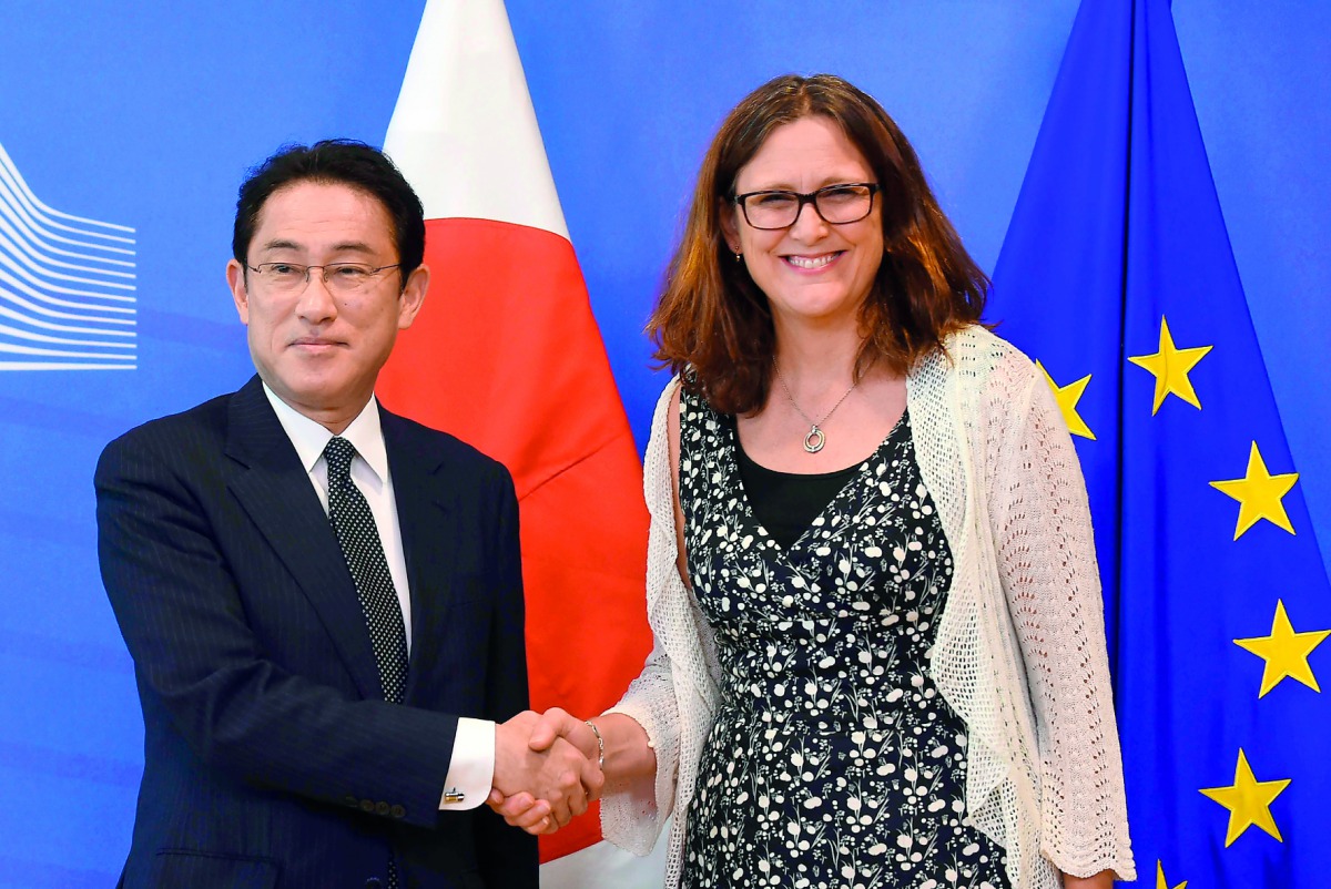 EU Commissioner of Trade Cecilia Malmstrom (right) with Japan Foreign minister Fumio Kishida before their meeting at the EU Headquarters in Brussels yesterday.