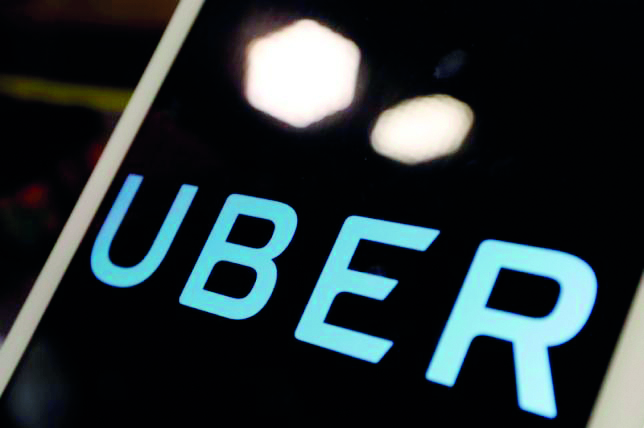 The logo of Uber is seen on an iPad, during a news conference to announce Uber resumes ride-hailing service, in Taipei