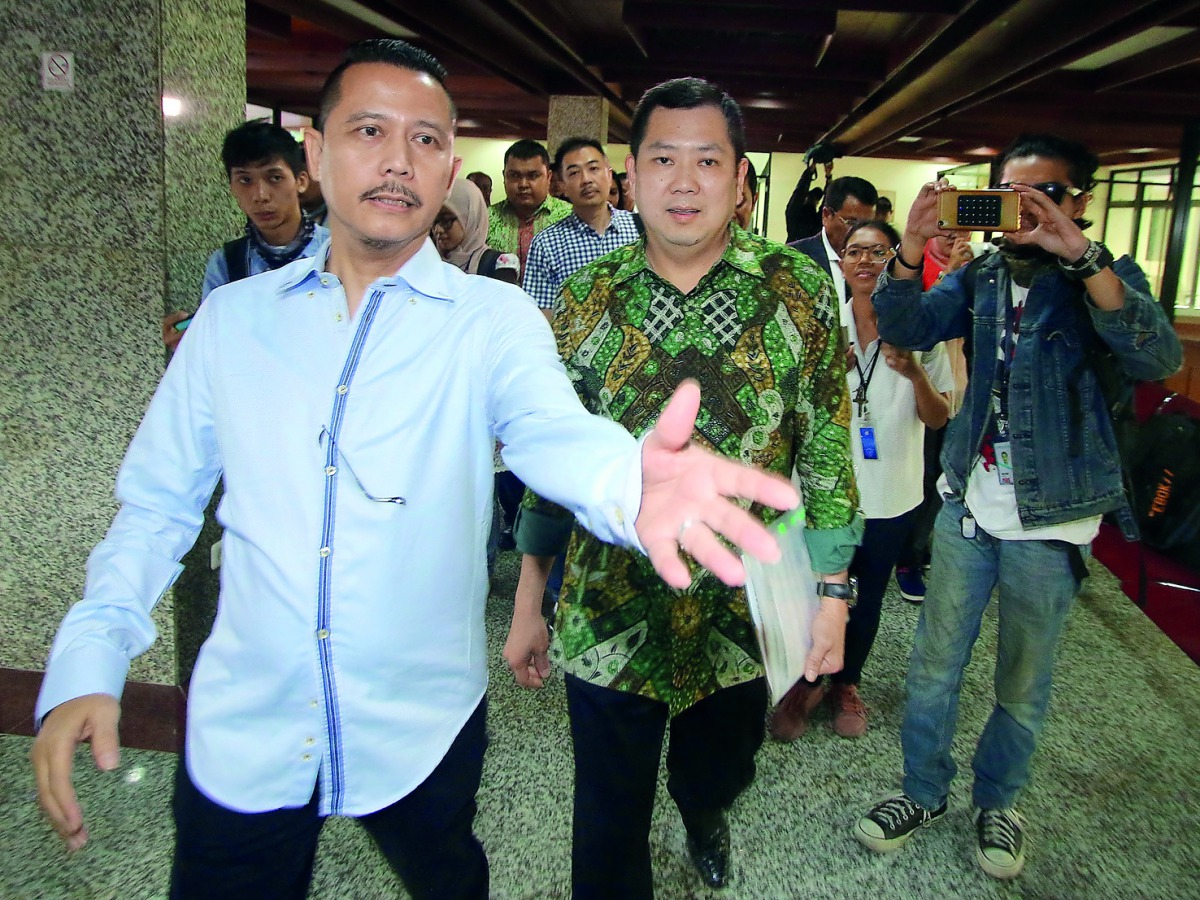 Hary Tanoesoedibjo (centre), a media and property mogul who is building two Trump Organisation projects, arrives at police special crime unit office in Jakarta, yesterday. US President Donald Trump's Indonesian business partner has been questioned by poli