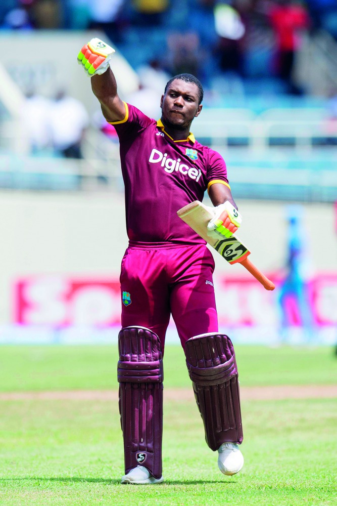 West Indies' Evin Lewis celebrates scoring a century during the T20 match against India at the Sabina Park Cricket Ground in Kingston, Jamaica on Sunday.