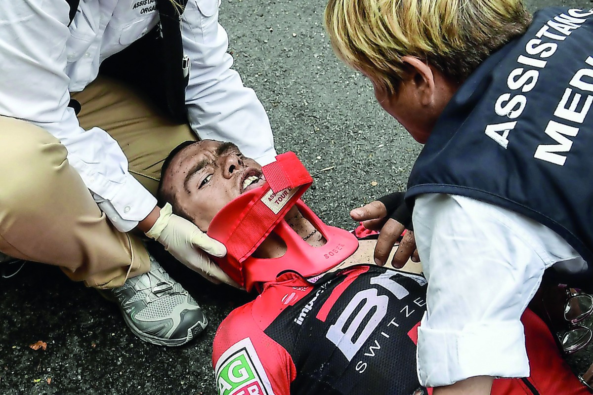 Australia's Richie Porte receives medical assistance after falling during the 181,5 km ninth stage of the 104th edition of the Tour de France cycling race on Sunday between Nantua and Chambery.