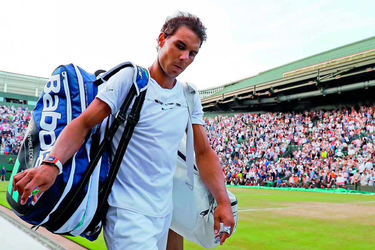 Spain's Rafael Nadal leaves the court after losing to Luxembourg's Gilles Muller on Monday.