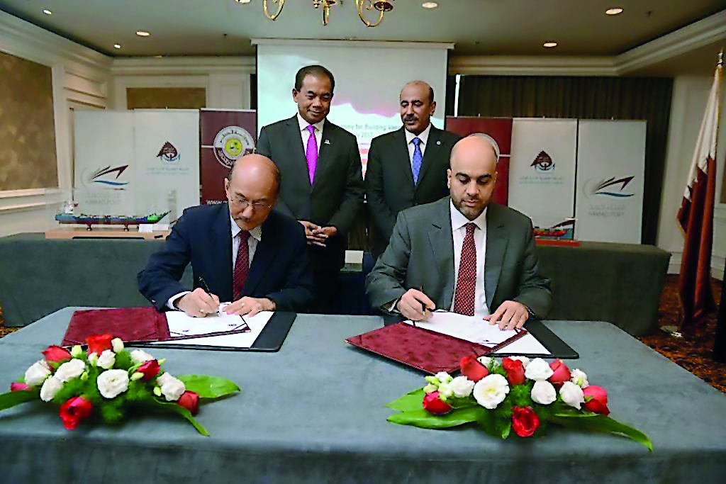 Minister of Transport and Communications, H E Jassim Saif Ahmed Al Sulaiti (standing right), who is also the Chairman of Mwani Qatar, witnessing the signing ceremony, between Mwani Qatar and Malaysian shipbuilding companies, in Kuala Lumpur, yesterday. 
