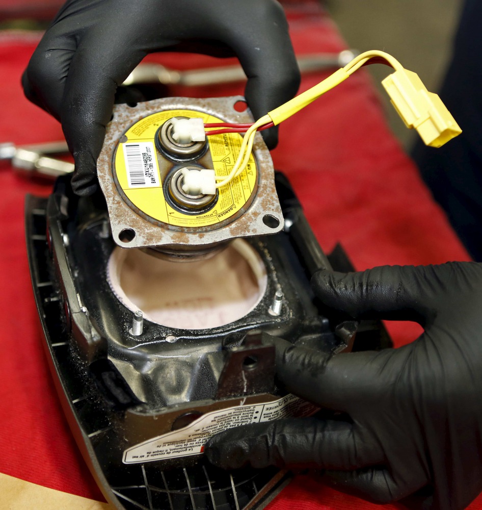 A recalled Takata airbag inflator removed it from a Honda Pilot at the AutoNation Honda dealership service department is shown in Miami, Florida in this June 25, 2015 file photo (Reuters / Joe Skipper) 
