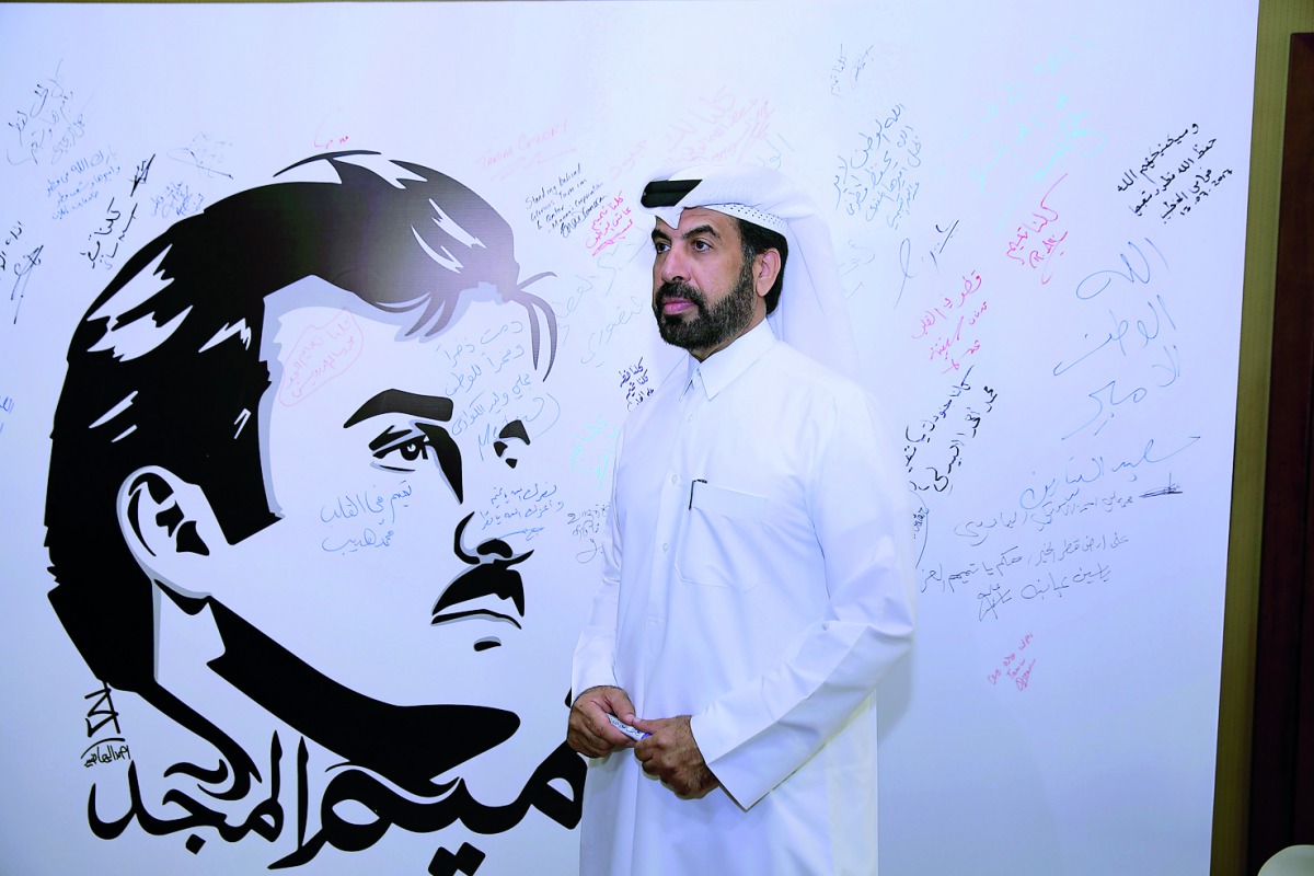 Rashid bin Ali Al Mansoori, CEO of QSE, seen against the backdrop of ‘Tamim Al Majd’ mural, yesterday.