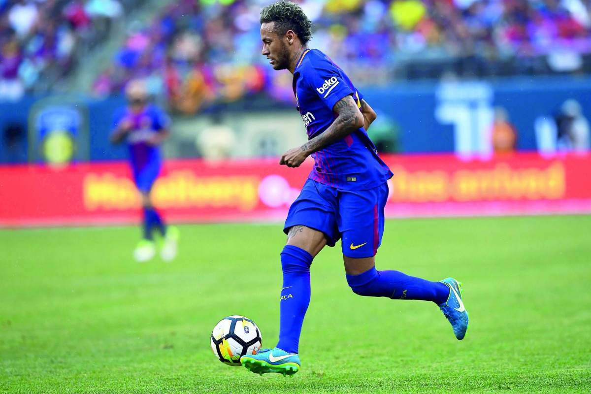 Barcelona’s Brazilian forward Neymar runs with the ball during the International Champions Cup (ICC) match  against Juventus FC at the MetLife Stadium in East Rutherford, New Jersey, on Saturday. 